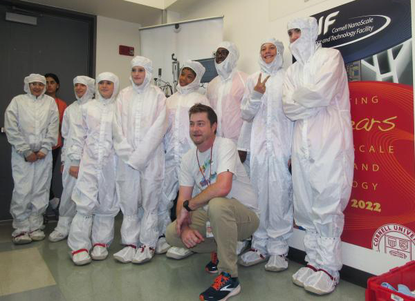 Students try on Tyvek coveralls with Tom Pennell