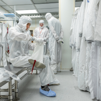 Image of REU students gearing up to enter the CNF Cleanroom