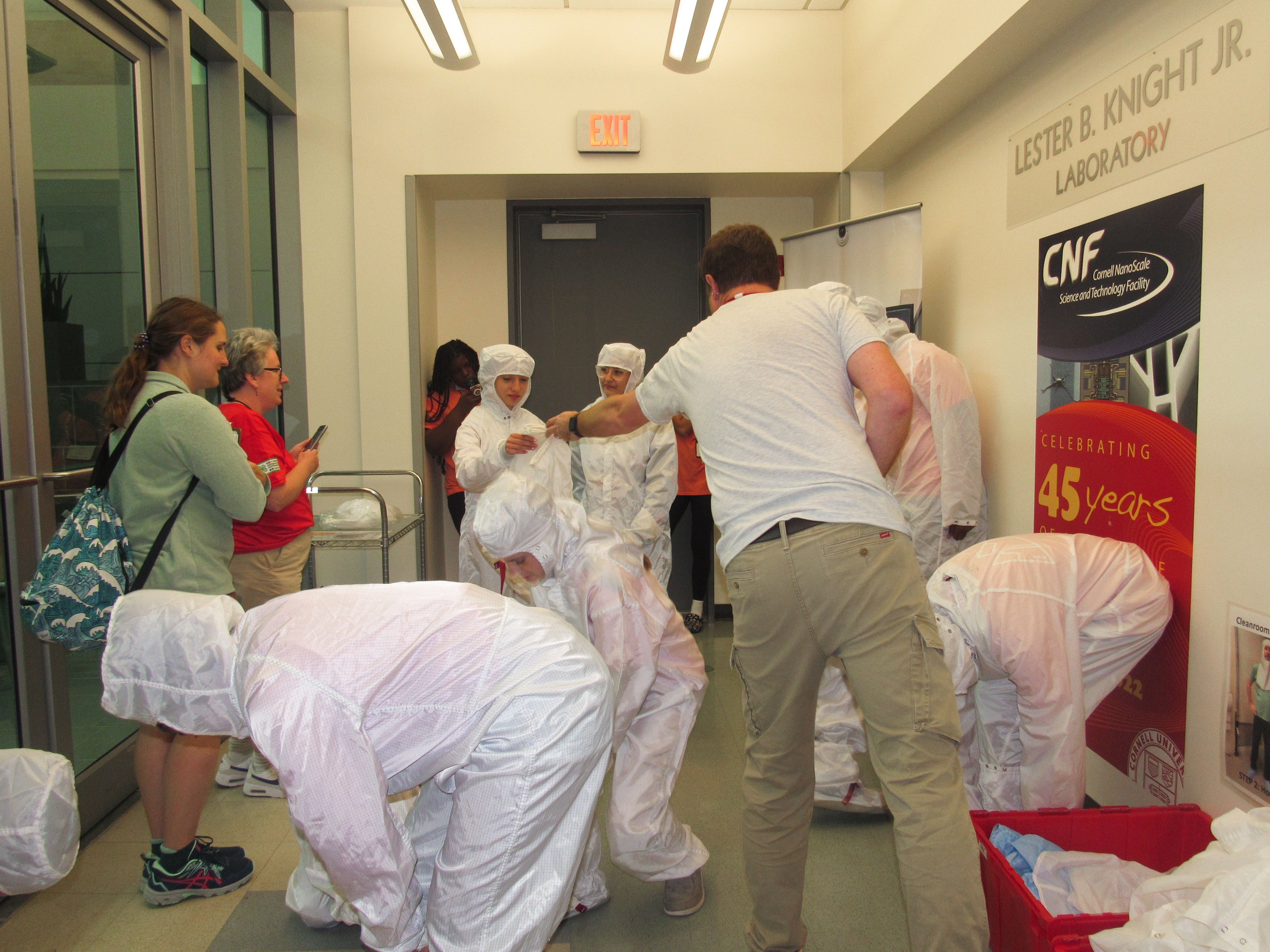 Pennell passes students Tyvek coveralls